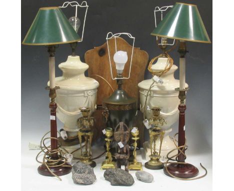 Two pairs of table lamps, a toleware style lamp, a walnut folding stand, two pairs of brass candle sticks (damaged) and fossi