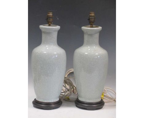 A pair of light blue crackle glazed ceramic lamps on wooden bases, 46cm high (2)Collection of dust and drit throughout, but o
