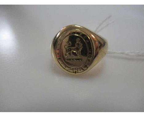 A signet ring stamped '18', weight 12.3gThe ring is slightly warped on the band and slight scratching to the surface commensu