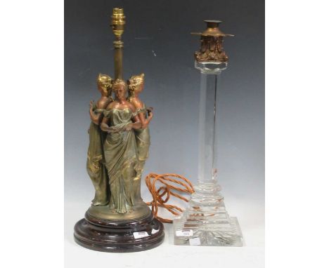 A large glass lamp with metal mounted corinthian capital sconce, 50cm high, and a spelter figural lamp base, 53cm high