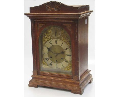 An Edwardian oak mantle clock, the brass dial with Roman chapter ring, CHIME/SILENT dial, 43cm high              