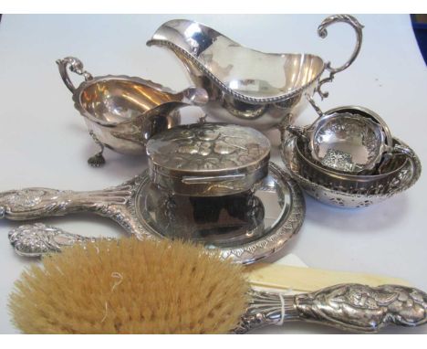 A quantity of assorted silverware including pepperettes, napkin ring, sauce boats, clothes brush, hand mirror, trinket box, r