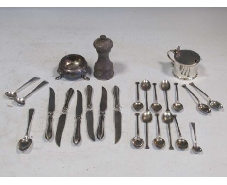 A silver pepper grinder, together with a silver mustard pot, salt and assorted silver spoons