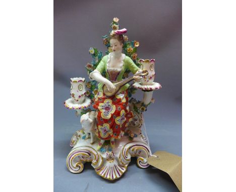 An early 20th century Meissen style porcelain figural candlestick holder, in the form of a lady playing a lute, H.27cm (a/f) 