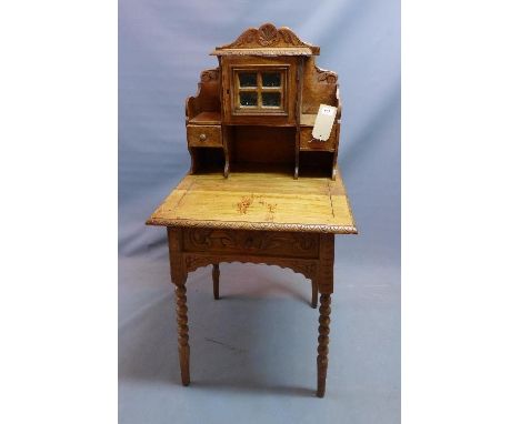 An early 20th century Continental oak side table, with superstructure over one drawer, raised on bobbin turned legs 