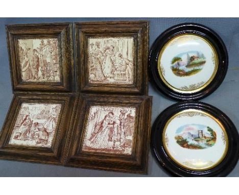A set of four early 20th century ceramic tiles, in oak frames, together with a pair of porcelain plaques 
