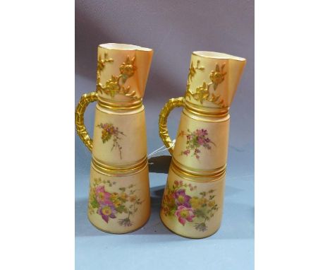 Two early 20th century Royal Worcester blush ivory porcelain jugs, with floral decoration, H.20cm 