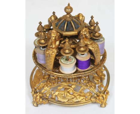 A Victorian gilt metal revolving bobbin stand, height 20cm.  