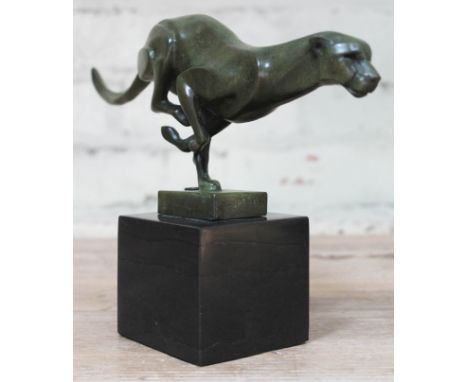 A contemporary French Art Deco bronze figure formed as a stylised cheetah on black marble base, Paris foundry stamp, length 3