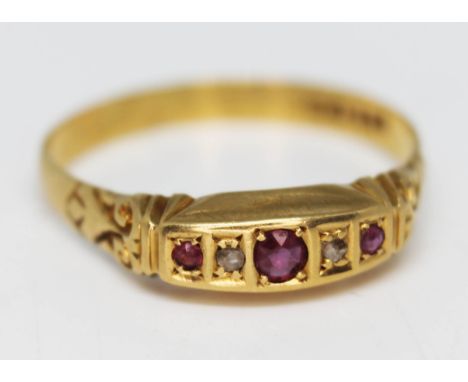 A hallmarked 18ct gold diamond and ruby ring, gross wt.2.4g, size U.  