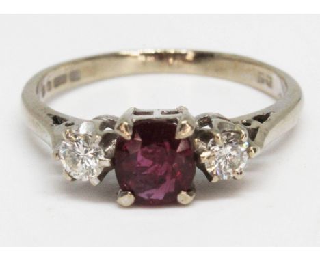 A diamond and ruby ring, hallmarked 18ct white gold band, gross wt. 3.1g, size N. 