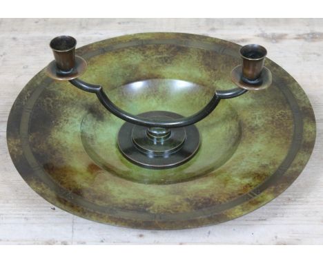 Two pieces of Danish metal ware by Just Andersen comprising a charger diam. 34cm and a candle stand length 24.5cm. Condition 