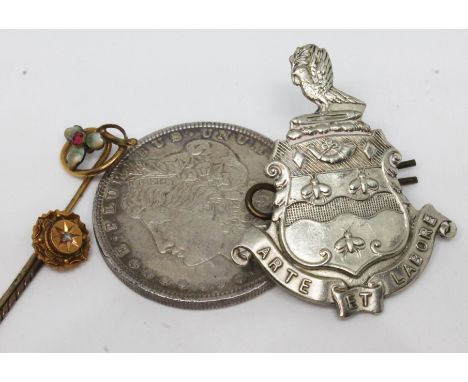 A mixed lot comprising two stick pins, a United States 1896 dollar and a Blackburn cap badge. 