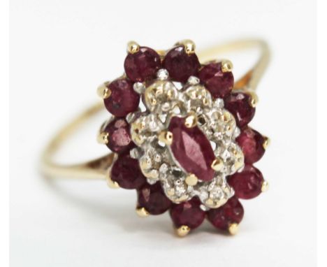 A 9ct gold cluster ring set with ruby coloured stones, 9ct gold import marks, gross wt. 2.1g, size O.  