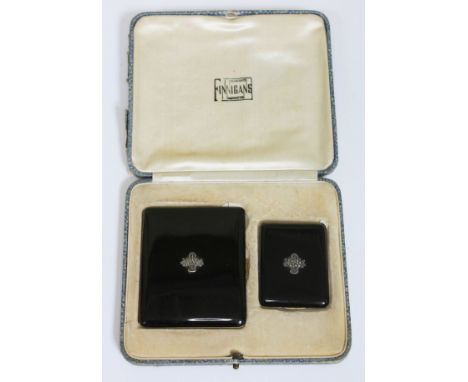 An Art Deco cased black enamel and gilt metal cigarette case and vesta case, Finnigans, Manchester. 