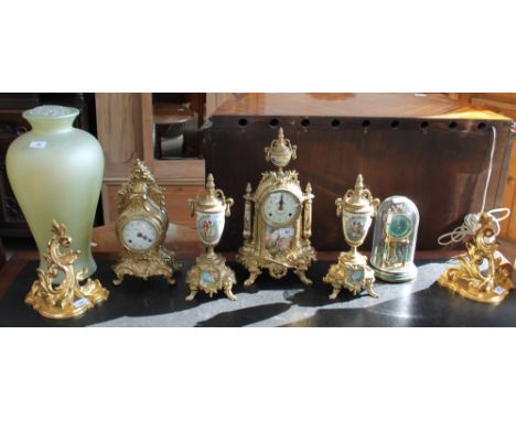 A modern gilt metal and pottery clock garniture together with a gilt metal mantle clock, an anniversary clock, a pair of gilt