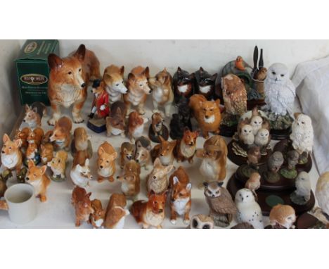 A Melba Ware corgi together with a collection of model craft including Beswick, cooper craft etc and a collection of owl mode