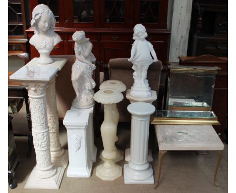 A matched pair of marble topped and cast resin columns with square bases together with other torcheres and columns, plaster f