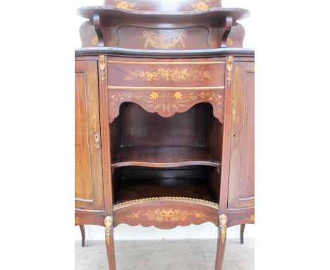 A 19th century mahogany chiffonier, the shield shaped upstand with a central mirror and shelf, above a kidney shaped base wit