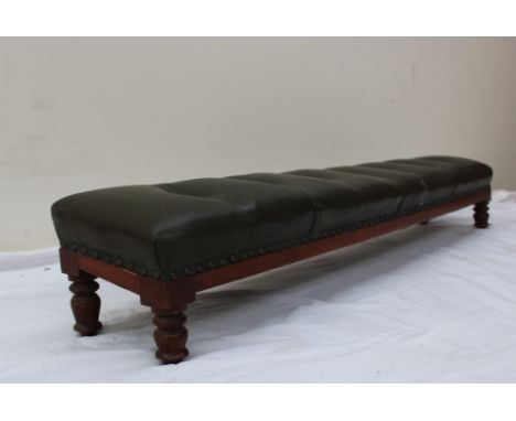 A Victorian kneeling stool with a button upholstered cushion on four ring turned legs, 124cm long x 22cm deep x 18cm high