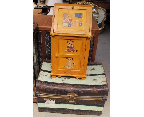 A tin trunk together with a child's bureau