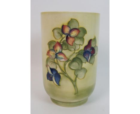 A Walter Moorcroft Bougainvillea pattern vase circa 1958, of tall cylindrical form, the pale lemon to green ground with tubel