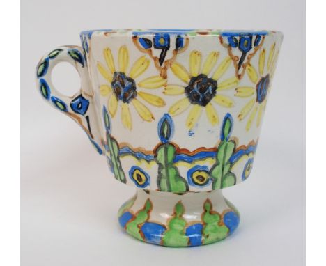 Jessie M King (1875-1949) A pottery mug hand painted with stylised floral and foliate decoration, in shades of blue, yellow, 