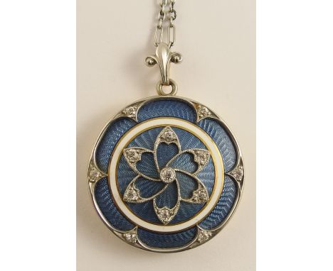 A Belle Epoque style guilloche enamel and diamond locket stamped 14 with an arrow to the interior, with diamond set white met
