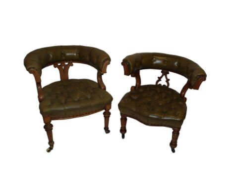 Two Victorian oak armchairs with leatherette button backs and arms and scroll seats on turned tapering legs, 76 and 80cm high