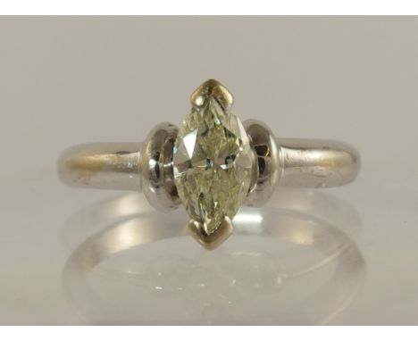 A diamond marquis solitaire ring of approx 0.90cts set in white metal, hallmarks polished out to be unreadable. Diamond appro