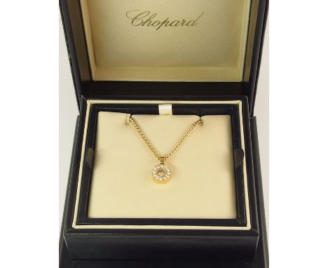 A Chopard 18ct gold happy diamonds pendant the round pendant is set with approximately 0.24cts surrounding the enclosed singl