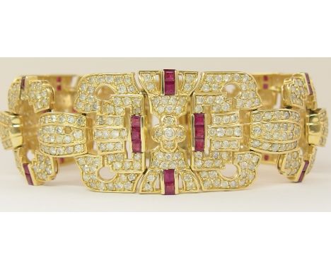 A 14ct ruby and diamond bracelet of Art Deco style the open work panels are set with both round brilliant cuts and square cut