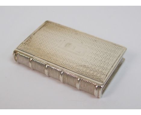 A silver vinaigrette by Taylor & Perry, Birmingham mark (year mark unclear), modelled as a book with engine turned decoration