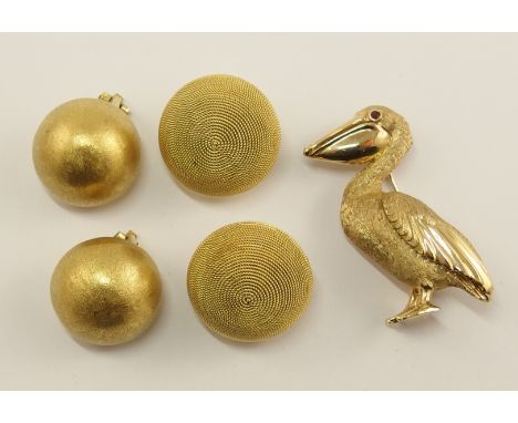 A 14ct gold brooch in the shape of a pelican with a ruby eye the inside inscribed Dankner copyright 14k, with hand engraved f