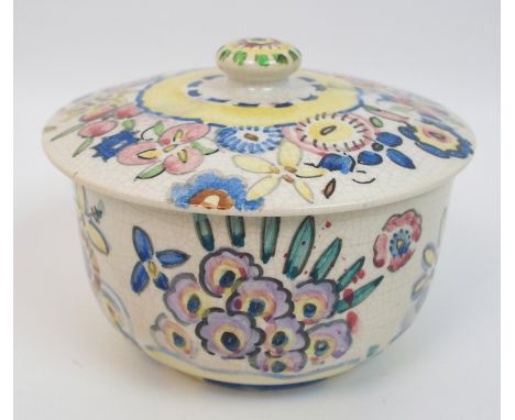 Jessie M King (1875-1949) A pottery bowl and cover hand painted with stylised floral decoration in shades of blue, yellow, pi