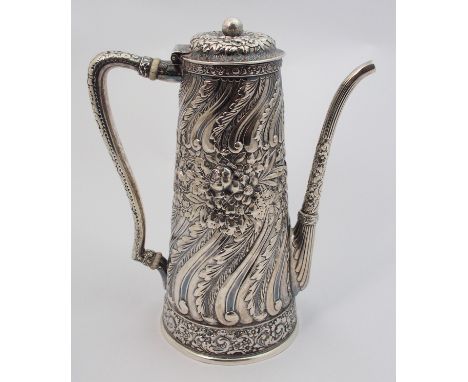 A silver coffee pot by Tiffany & Co., marked 5362M6469 Sterling silver of tapering cylindrical form with spiral leafy embossi
