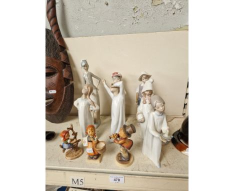 Eight Lladro figurines together with three Goebel figures. 