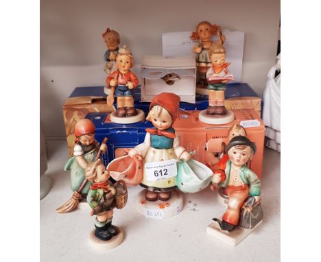 9 Hummel figurines and a boxed ‘Bee Badge (issued year 2000 - figurines include ‘Merry Wanderer’ 1950-55 and 4 boxed figures-