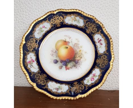 A Royal Worcester plate, hand painted with fruit, with floral, gilt and cobalt blue border, signed Seabright.Condition- Some 