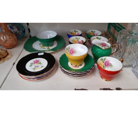 A vintage Imperial bone china tea set decorated with flowers and 22 carat gold, 21 pieces in total.