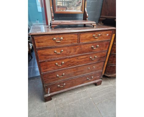 A George III mahogany chest of drawers with campaign style brass carry handles to sides, brass swan neck handles and bracket 