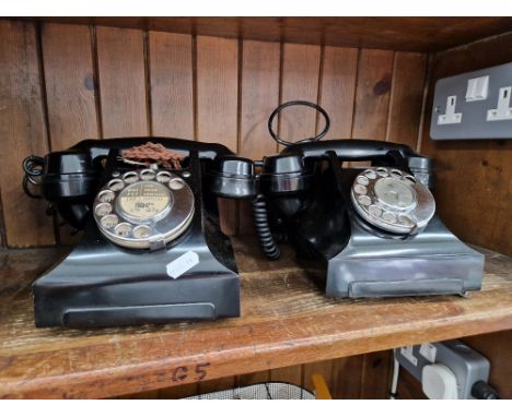 Two black bakelite GPO telephones. 