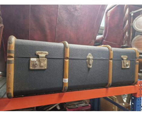 A vintage beech bound travel trunk. 