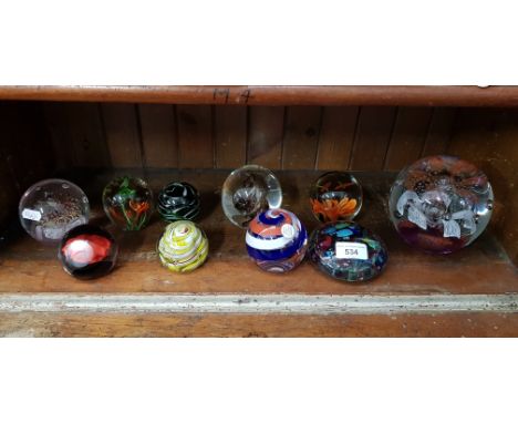10 glass paperweights including Caithness and a large, heavy example approx 13cm diameter