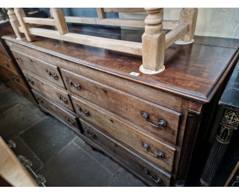A George III mahogany mule chest with fluted columns and ogee bracket feet, length 183cm, depth 56cm &amp; height 100cm.