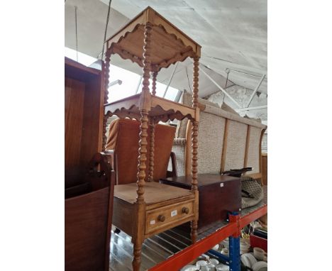A Victorian pine whatnot/shelving unit on bobbin turned supports.