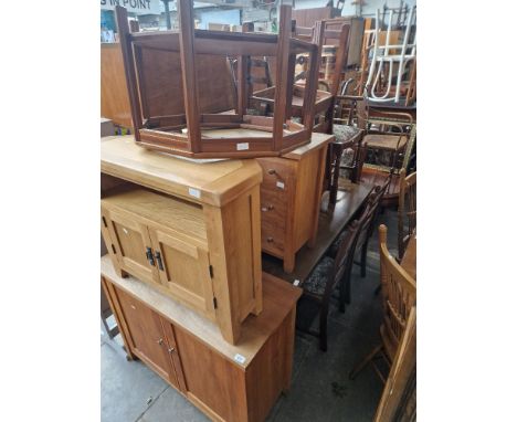 Assorted furniture comprising a light wood cabinet, a light wood chest of drawers, a light wood AV cabinet, a refectory table