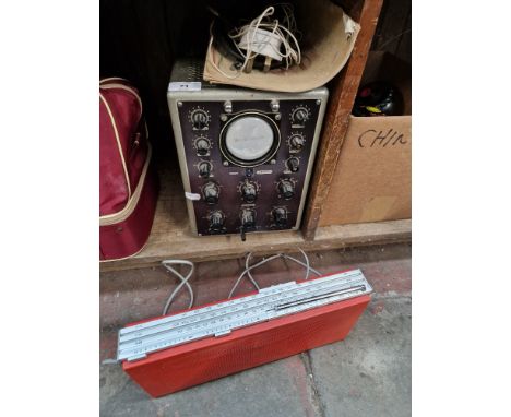 &nbsp;A vintage Phillips cathode-ray oscilloscope GM 5659/01 along with a 1970s Bang &amp; Olufsen Beolit 700 radio in red.