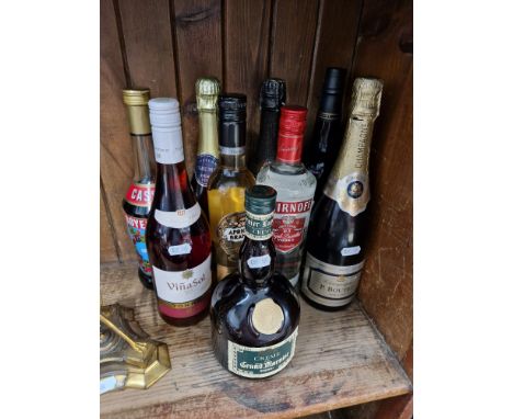 A group of alcoholic beverages, 9 bottles including P Boutet Champagne, Smirnoff vodka, wines, sherry, Grand Marnier, Cassis,