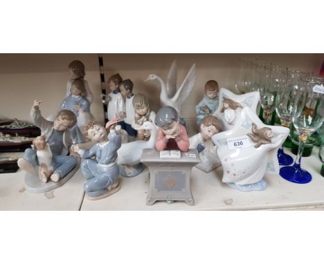 13 Nao figurines including boy playing with dog, boy playing with aeroplane, boy at desk, girls in front of stars etc